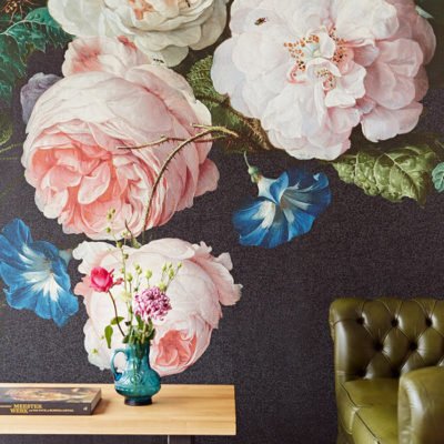 Bold floral wallpaper with large pink and white peonies and green leaves on a dark background